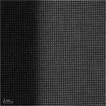 High resolution electron microscope image of lanathum strontium manganate on left, bismuth ferrite on right.